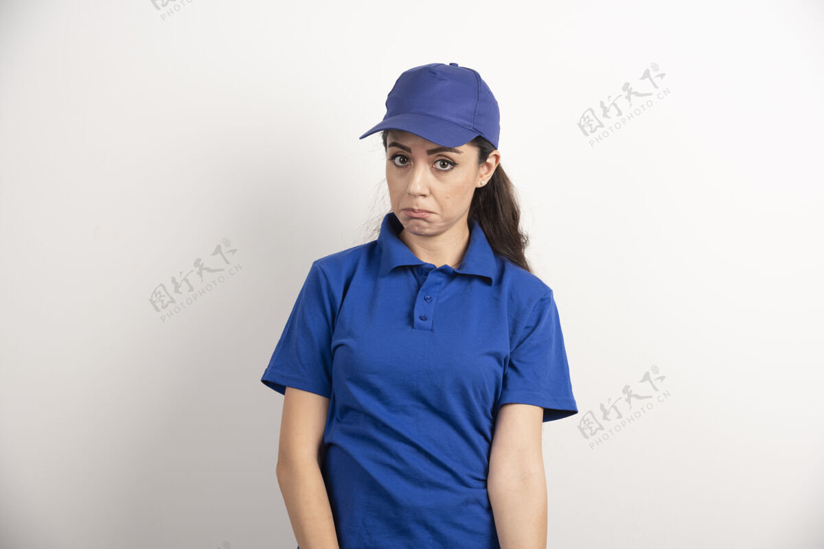 服务穿着蓝色制服的漂亮女人用手触摸她的脸高质量的照片工作人年轻人