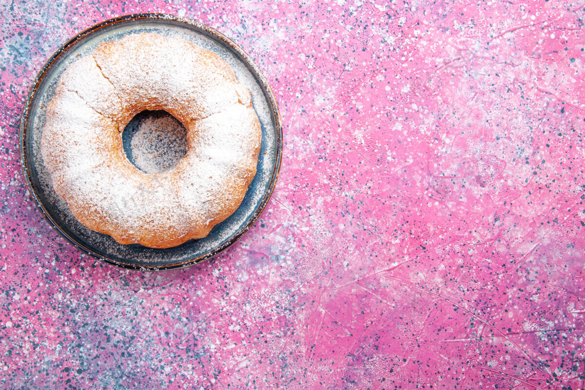 粉末浅粉色表面形成的糖粉蛋糕圆形顶视图圆形光含糖